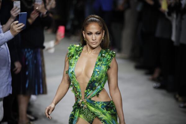Milan Fashion J Lo struts updated jungle dress at Versace AP News